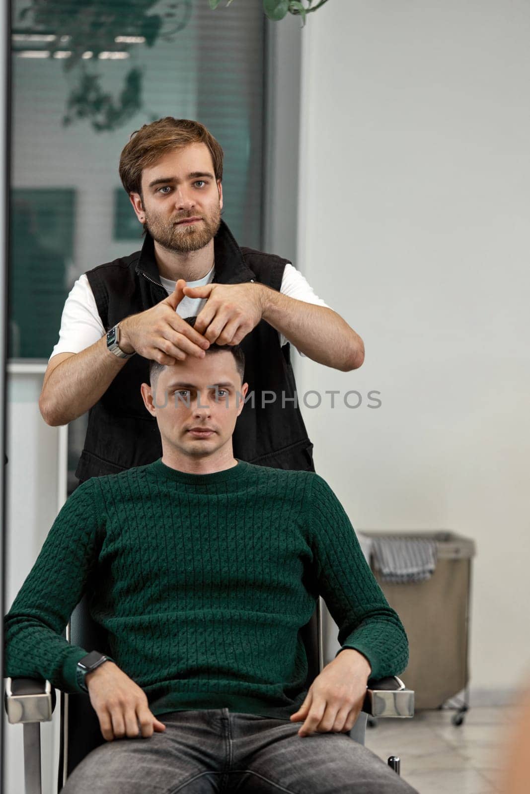 caucasian man getting haircut by professional male hairstylist by erstudio