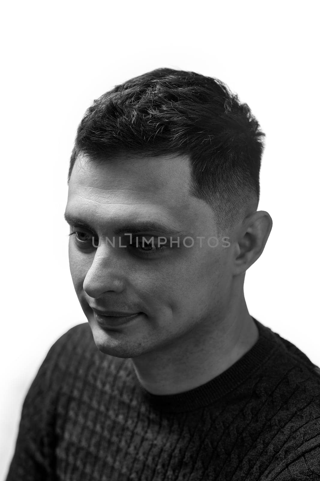 young man with stylish hair and beard on white background