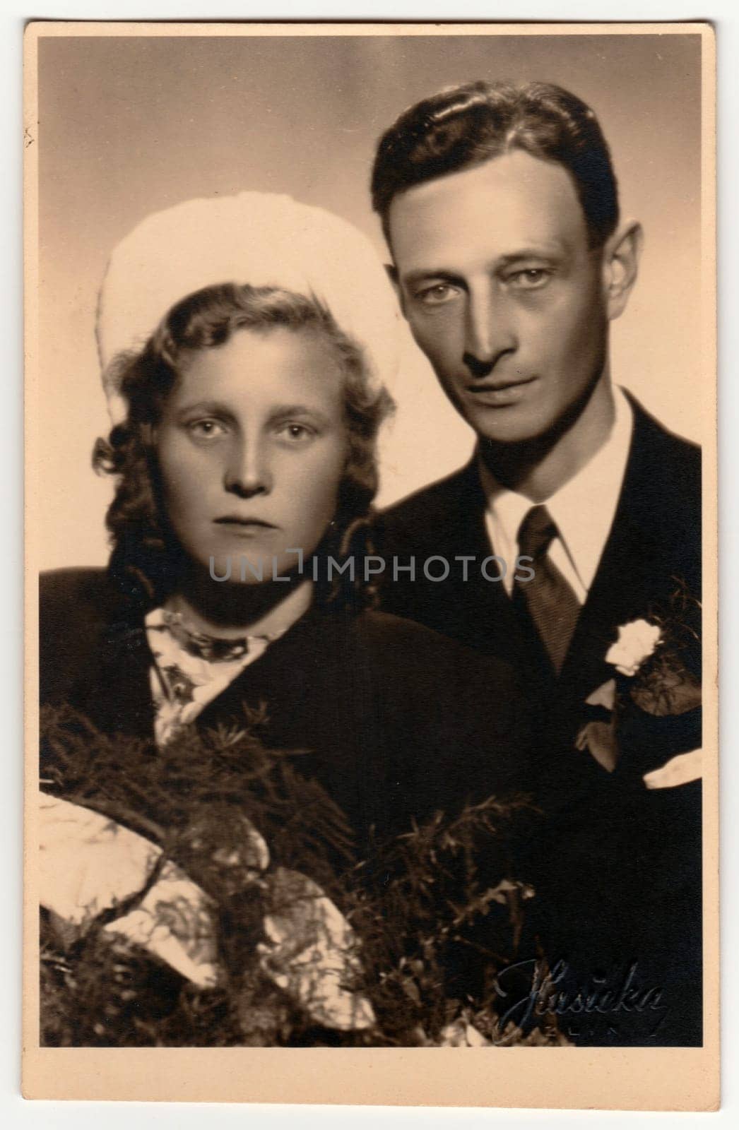 Vintage photo shows newlyweds. Retro black and white studio photography. Circa 1940s. by roman_nerud