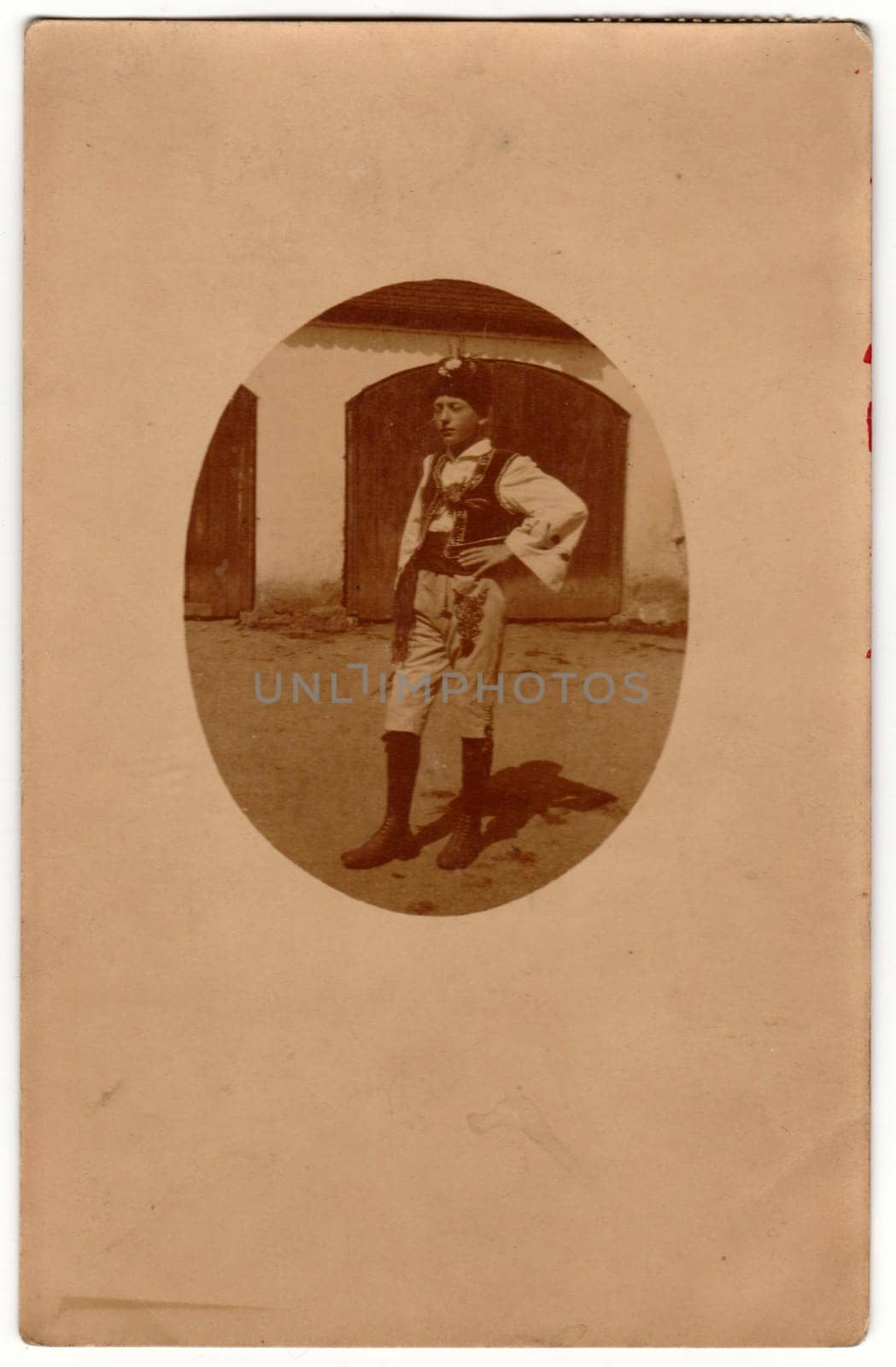 Vintage photo shows a young boy wears traditional Moravian folk costume. Retro black and white photography. Photo was taken in Austro-Hungarian Empire or also Austro-Hungarian Monarchy. Circa 1920s. by roman_nerud