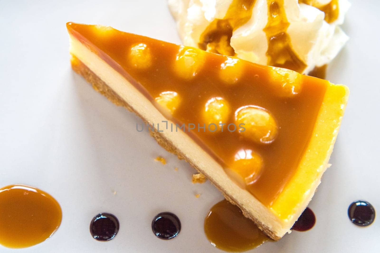 macadamia caramel cake on a plate cuisine dessert sweet food.