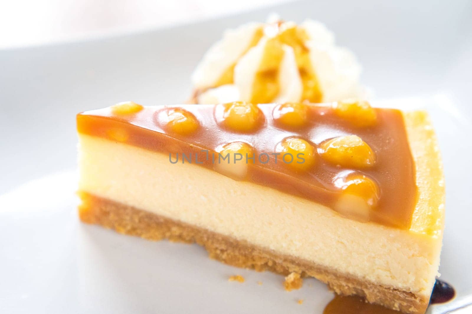 macadamia caramel cake on a plate cuisine dessert sweet food.