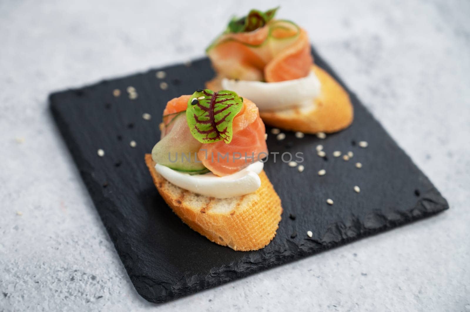 Sandwich with bread salmon slices and soft cheese