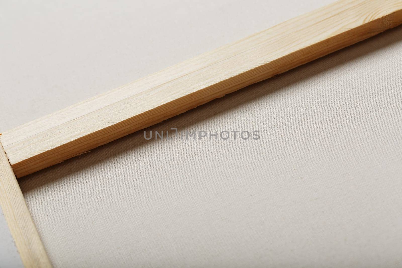 Canvas for artists stretched on a wooden rail, as a background by AlexGrec