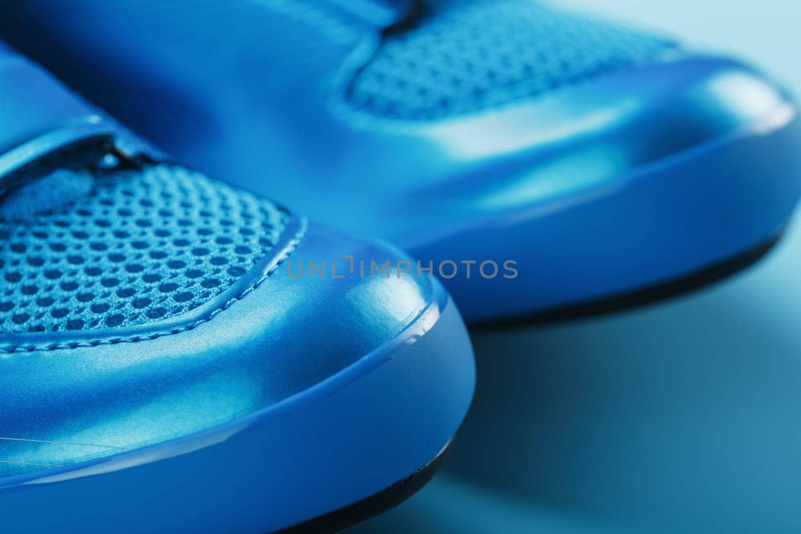Blue highway cycling shoes on a blue background by AlexGrec