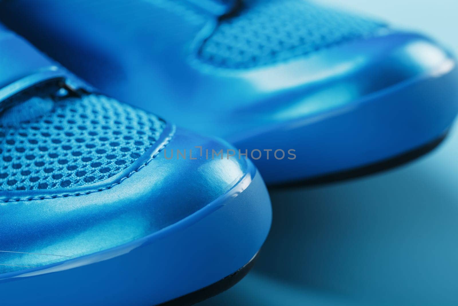 Blue Shiny Bicycle Shoes for Road Bike on Blue Background