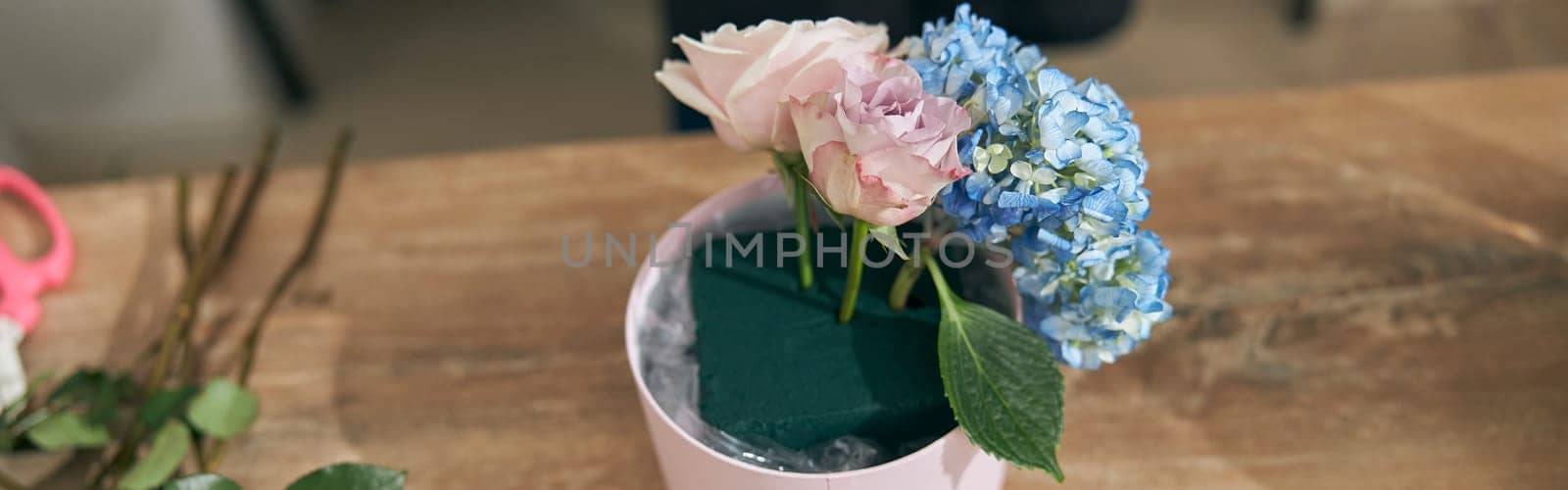 happy professional woman is working in flower shop