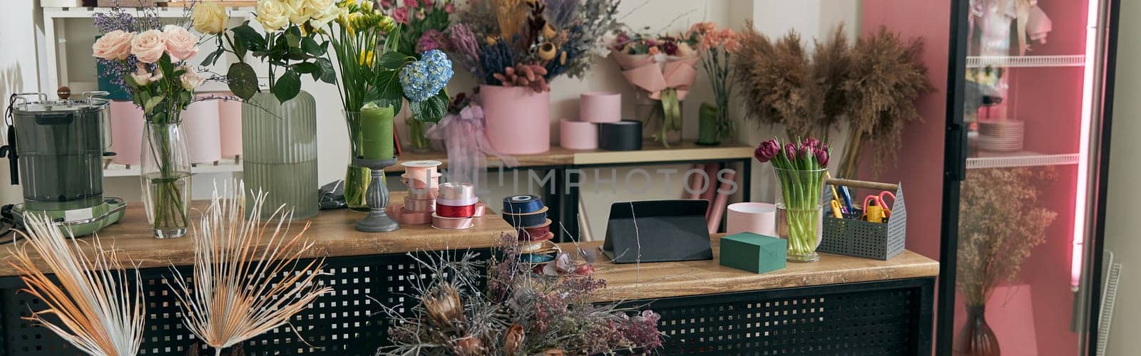 happy professional woman is working in flower shop