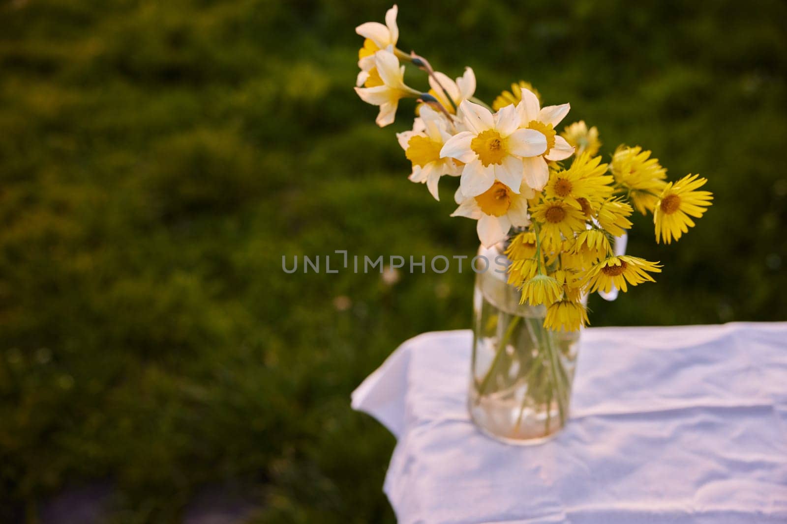 a bouquet of spring flowers standing in a vase on the street. High quality photo