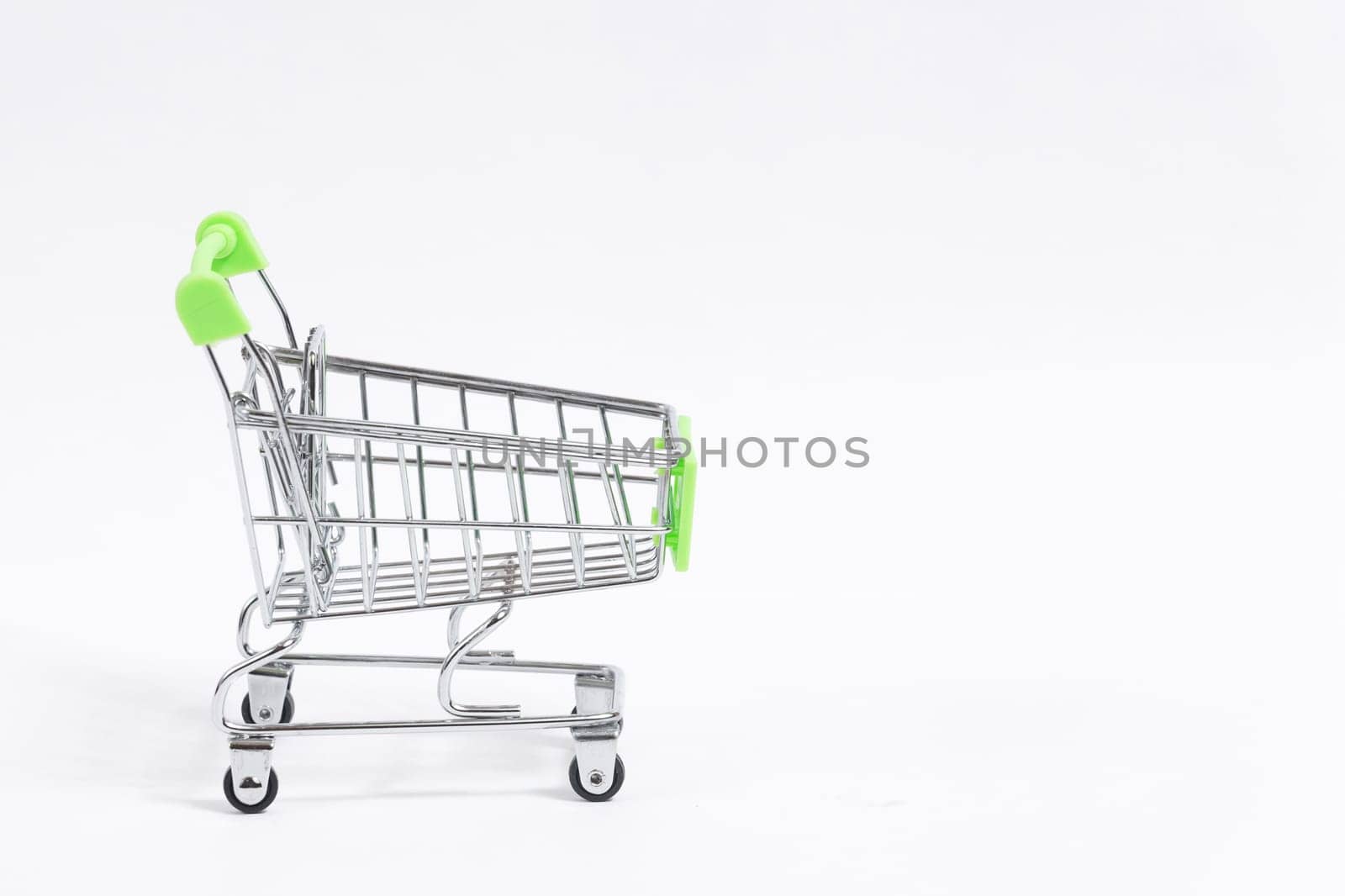 Shopping trolley cart isolated on white background, copy space.