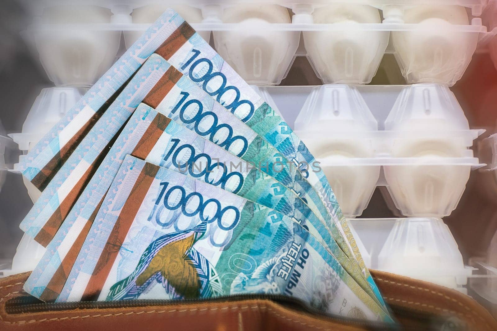 Rising prices for eggs in Kazakhstan. Tenge in a wallet against the background of a counter with eggs.