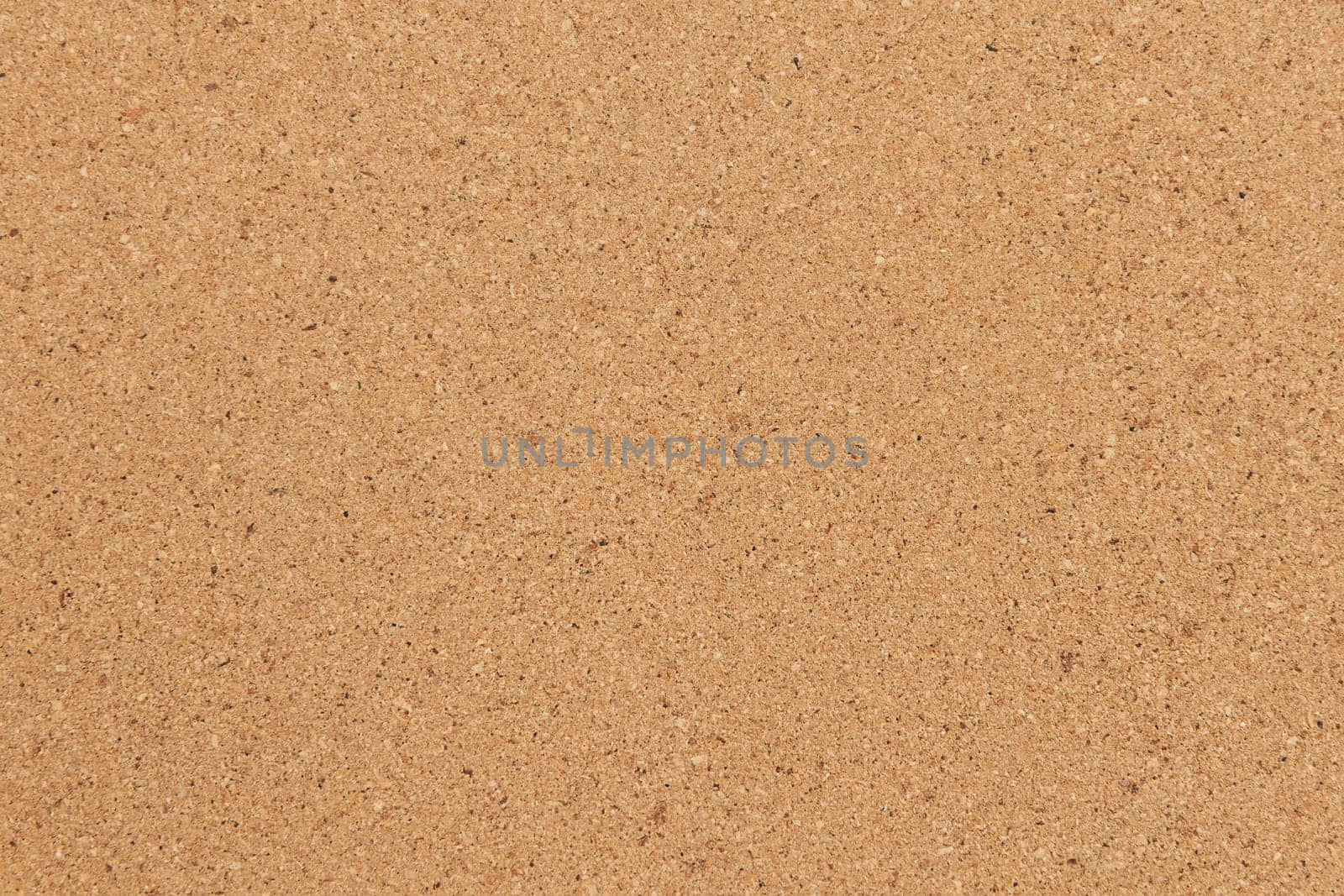 Cork background in beige color. Brown cork texture.