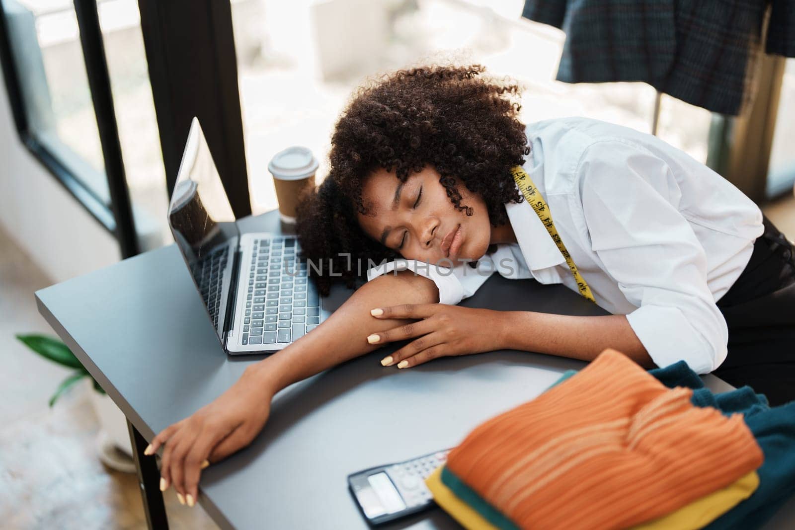 young teen african american fashion designer stylish burnout working at fashion Business studio.