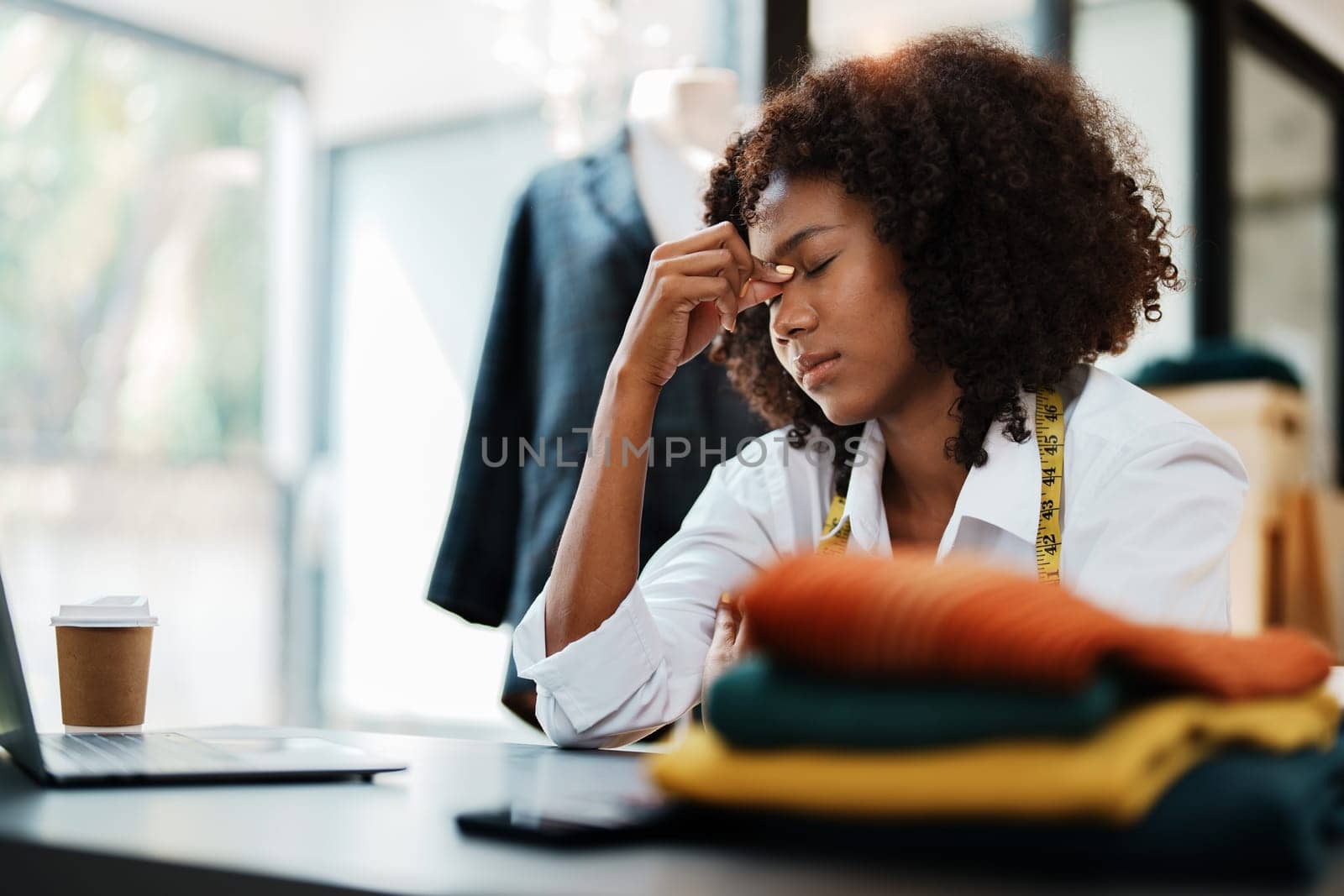 young teen african american fashion designer stylish burnout working at fashion Business studio.