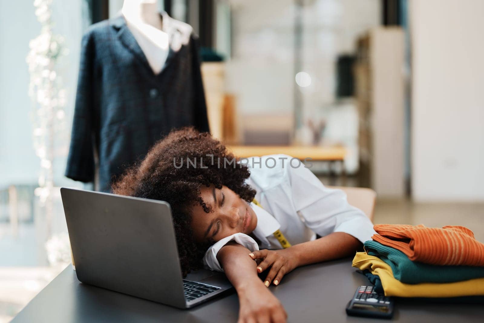 young teen african american fashion designer stylish burnout working at fashion Business studio.