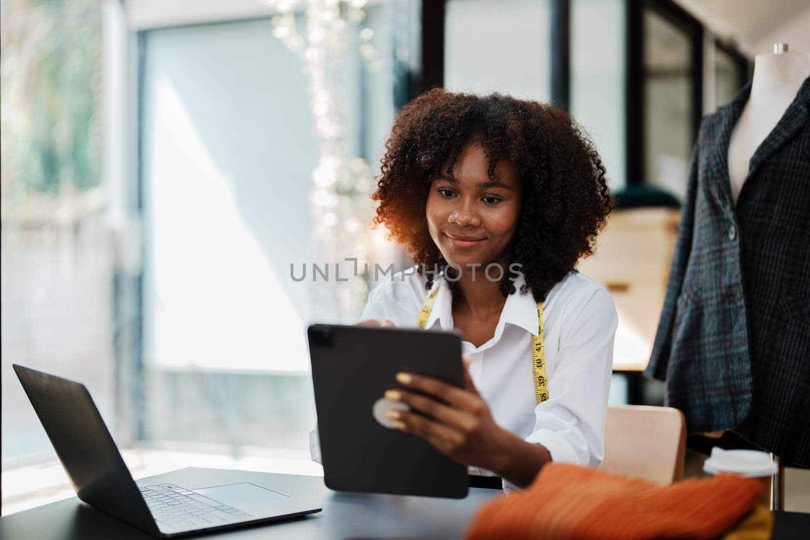 young teen african american and asian woman fashion designer stylish and friend working at fashion Business studio.