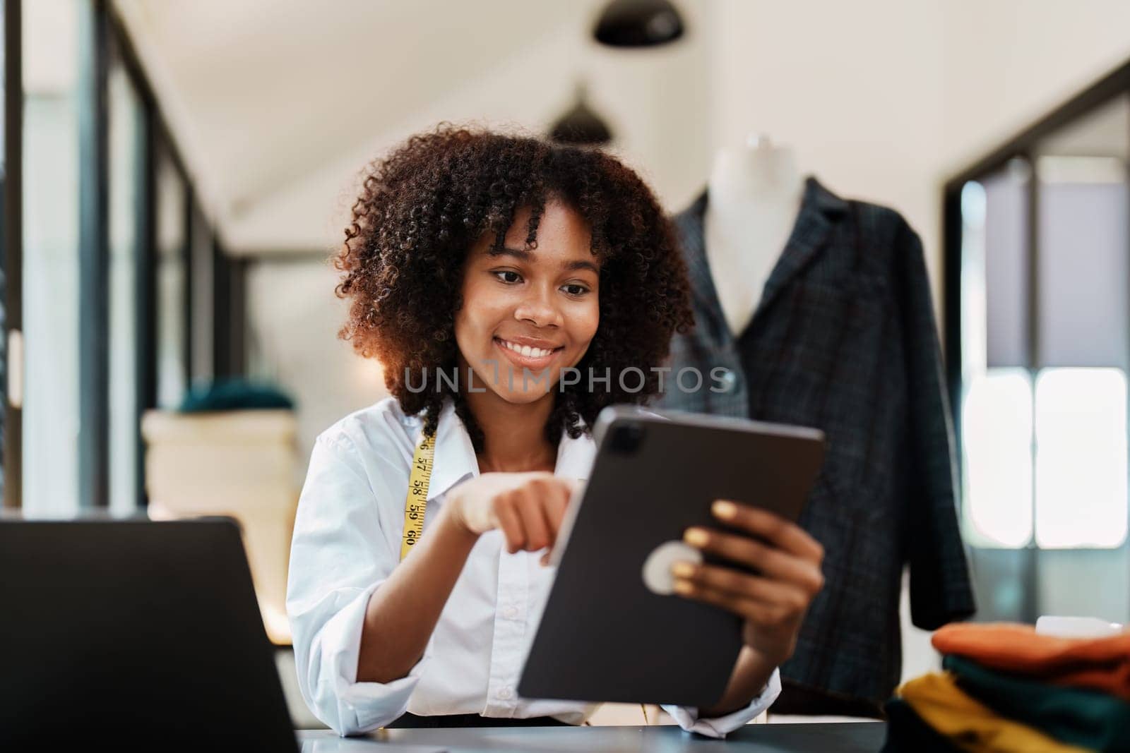 young teen african american and asian woman fashion designer stylish and friend working at fashion Business studio.