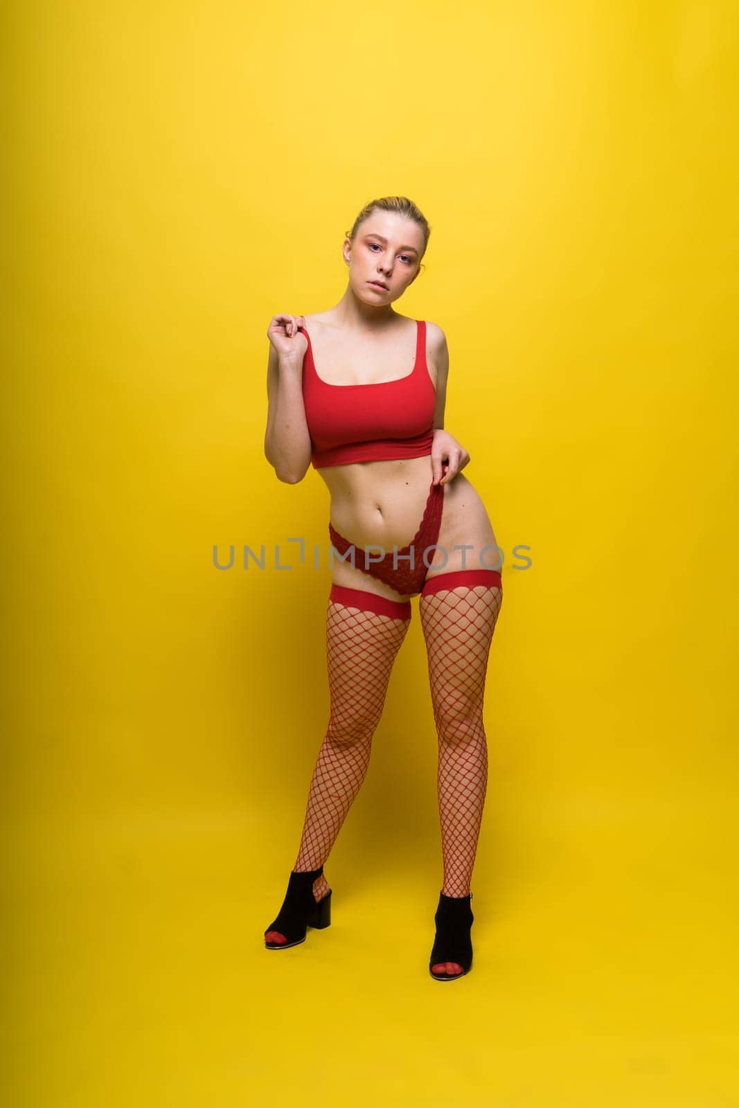 Young woman posing in underwear studio background. Perfect plump body, seductive lingerie. by Zelenin