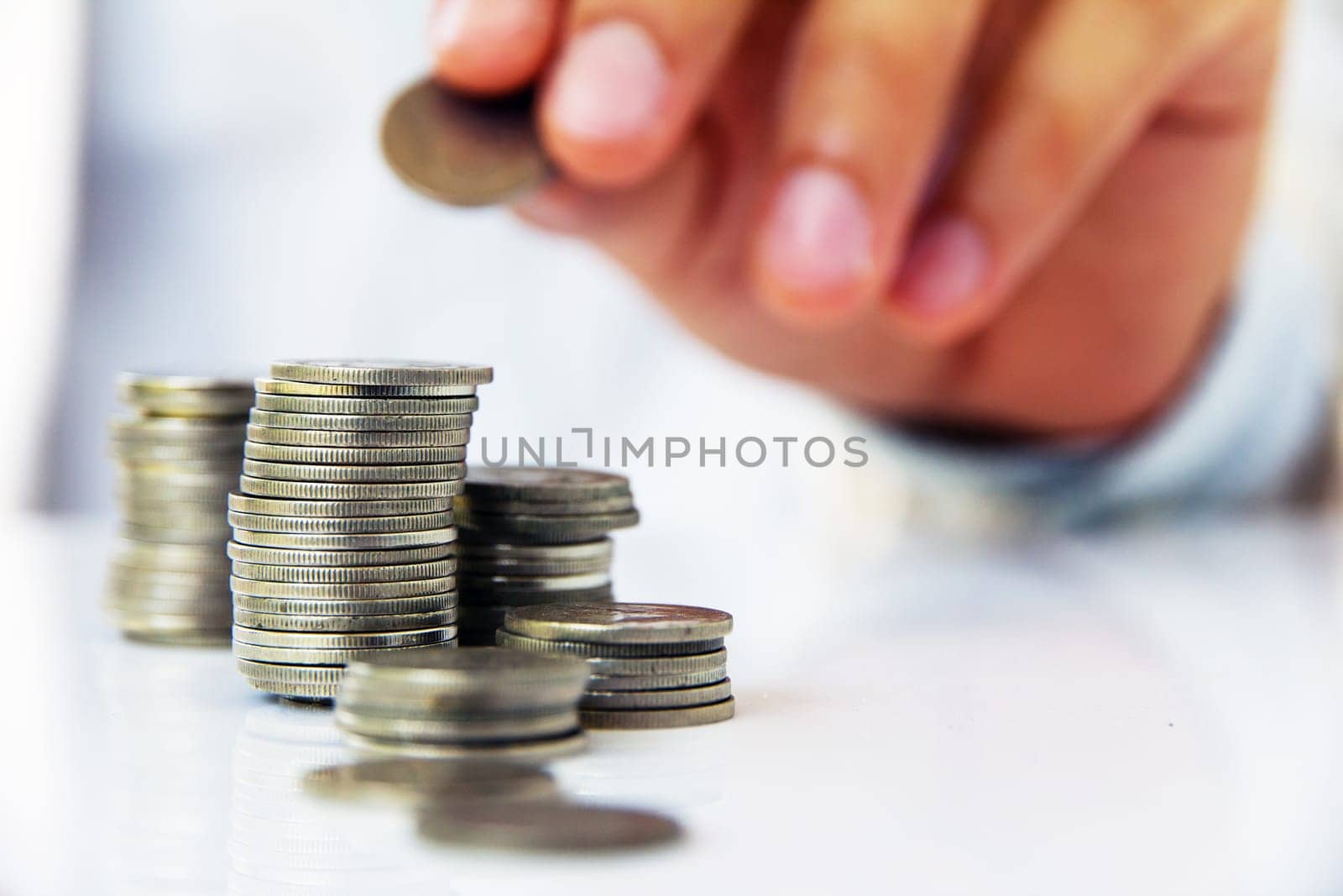 Image of Hand put coin to stack, investment concept