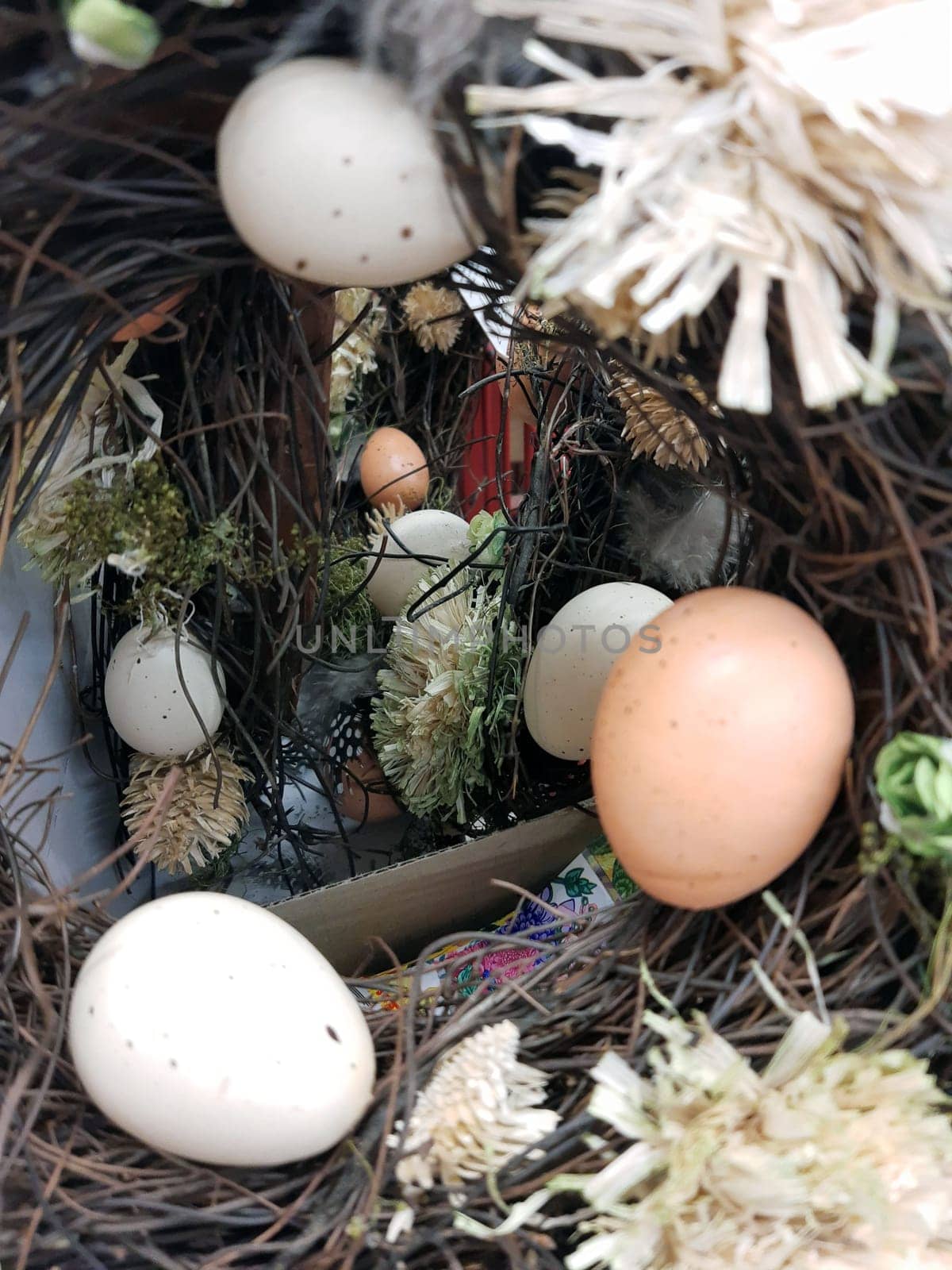 On the eve of Easter, festive decorations in the form of colorful Easter eggs and decorative greenery.