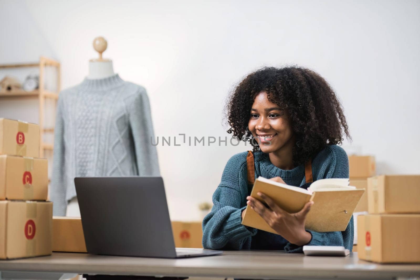 Startup small business entrepreneur SME, asian woman packing cloth in box. Portrait young Asian small business owner home office, online sell marketing delivery, SME e-commerce telemarketing concept...