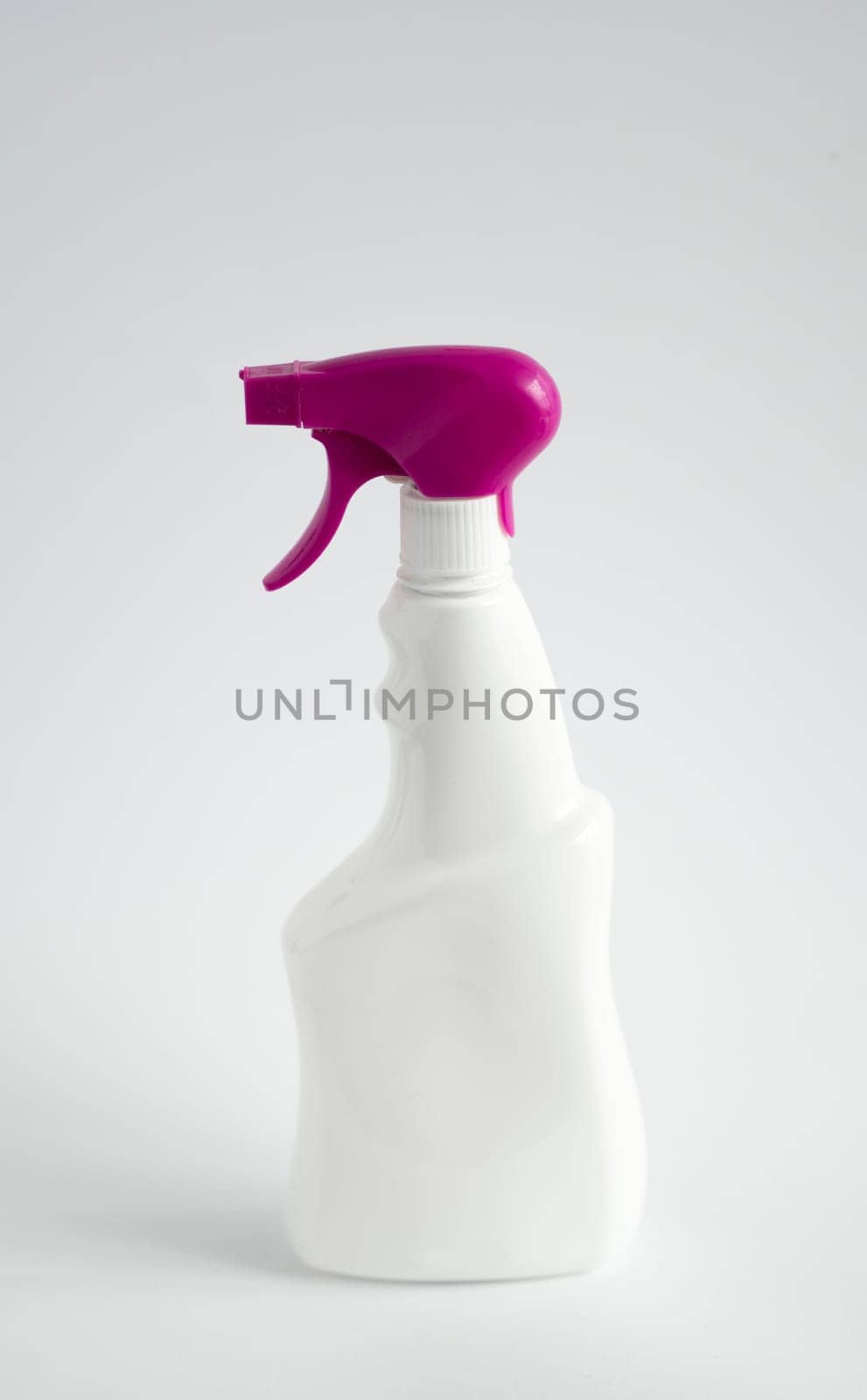 White plastic spray bottle for liquid cleaning products isolated on white background. Packaging mockup bottle with sprayer