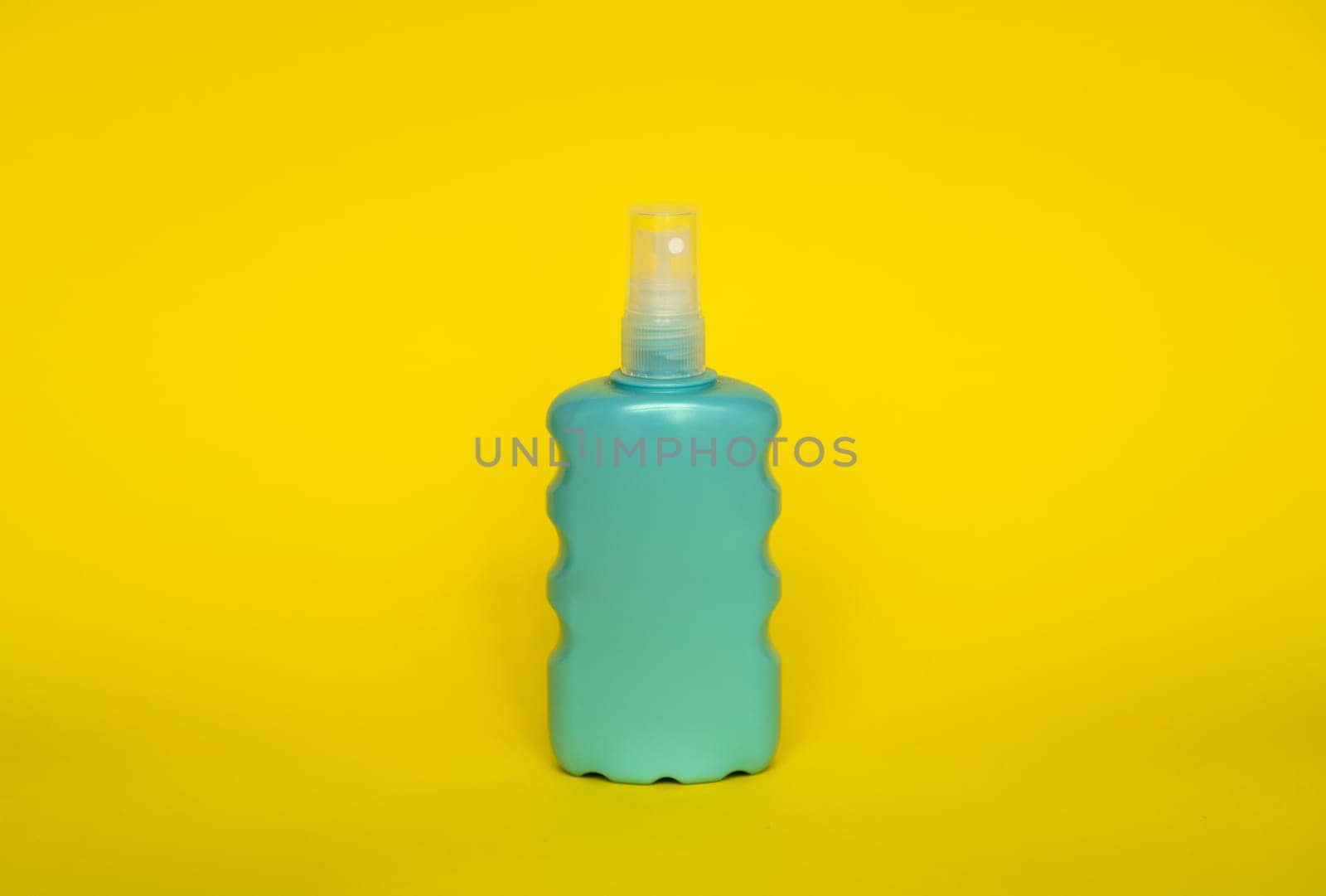 Blue blank unbranded cosmetic plastic bottle for shampoo, gel, lotion, cream, bath foam yellow background. by vovsht