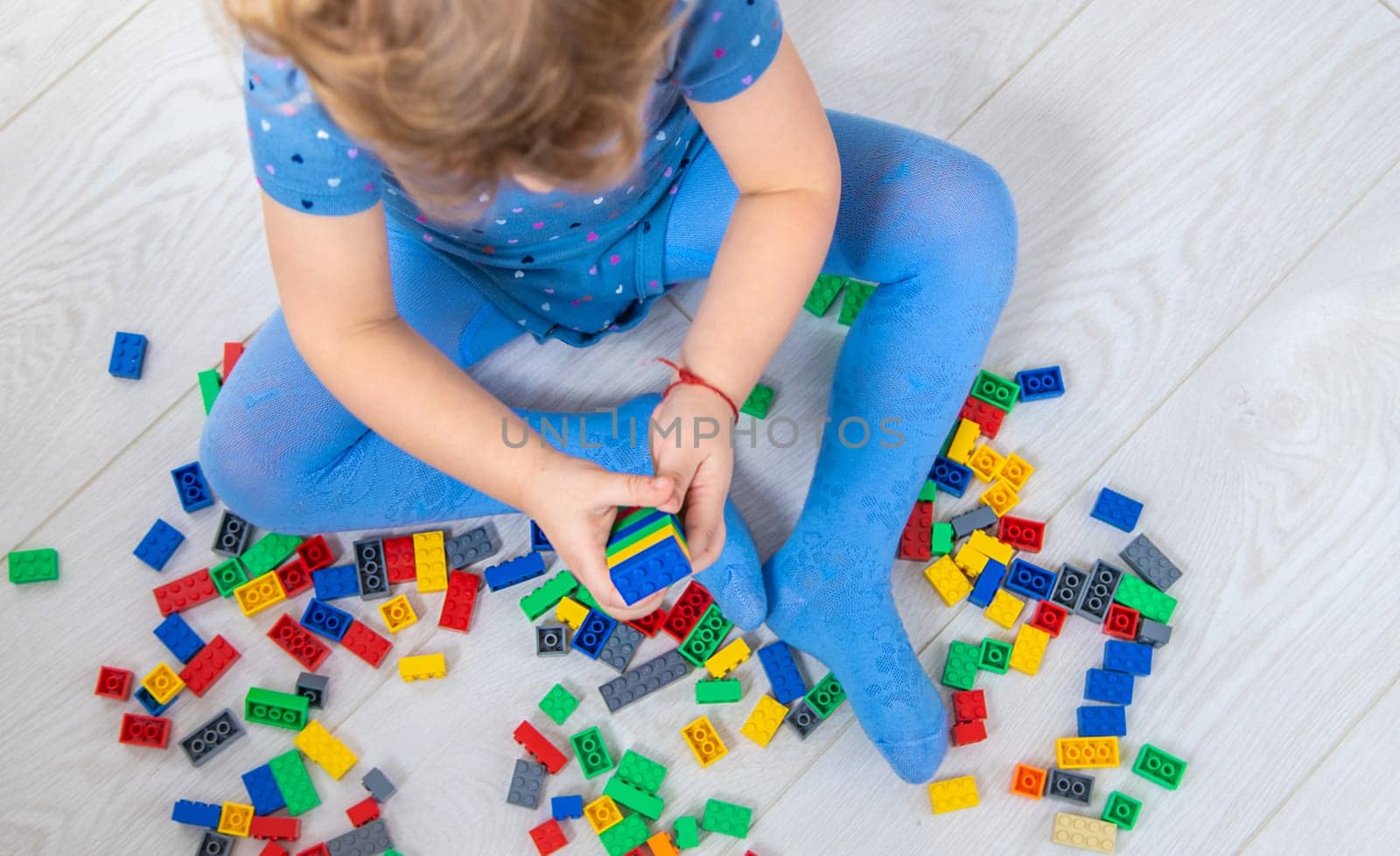 The child plays as a constructor. Selective focus. Kid.