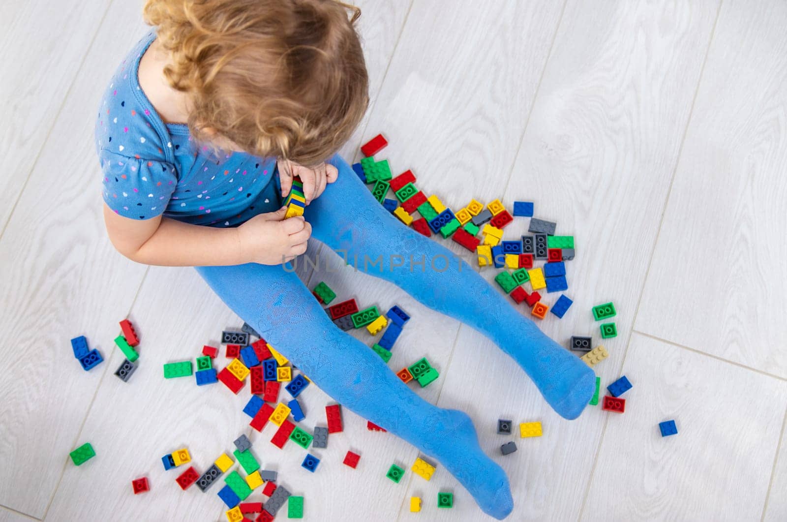 The child plays as a constructor. Selective focus. by yanadjana