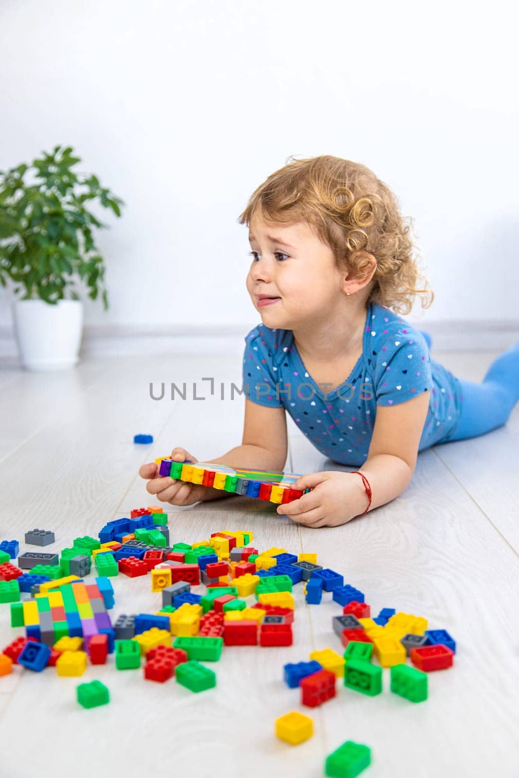 The child plays as a constructor. Selective focus. by yanadjana