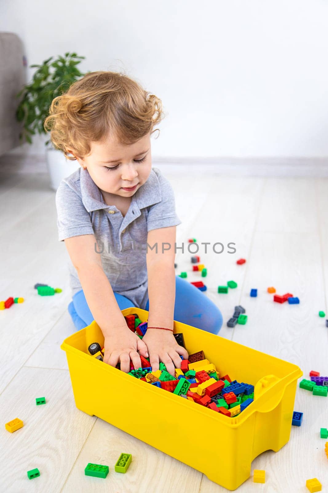 The child plays as a constructor. Selective focus. by yanadjana