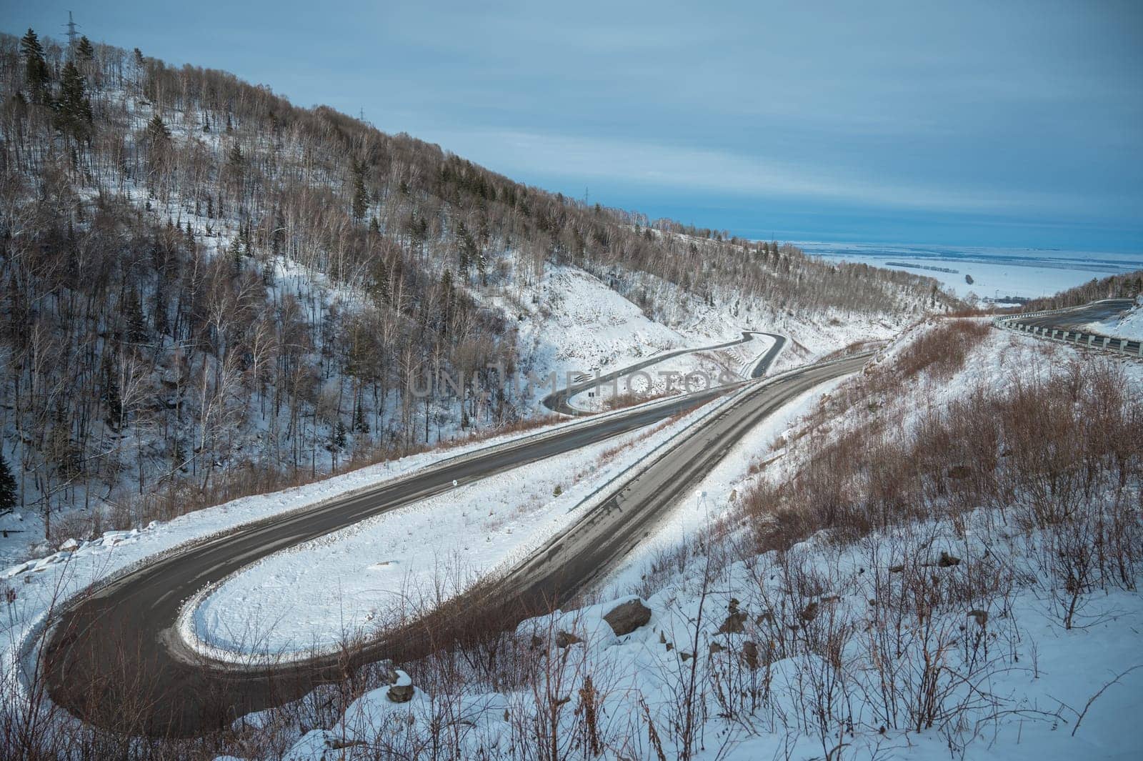 Winter serpentines road in Belokurikha, Siberia. Sunny winter day.