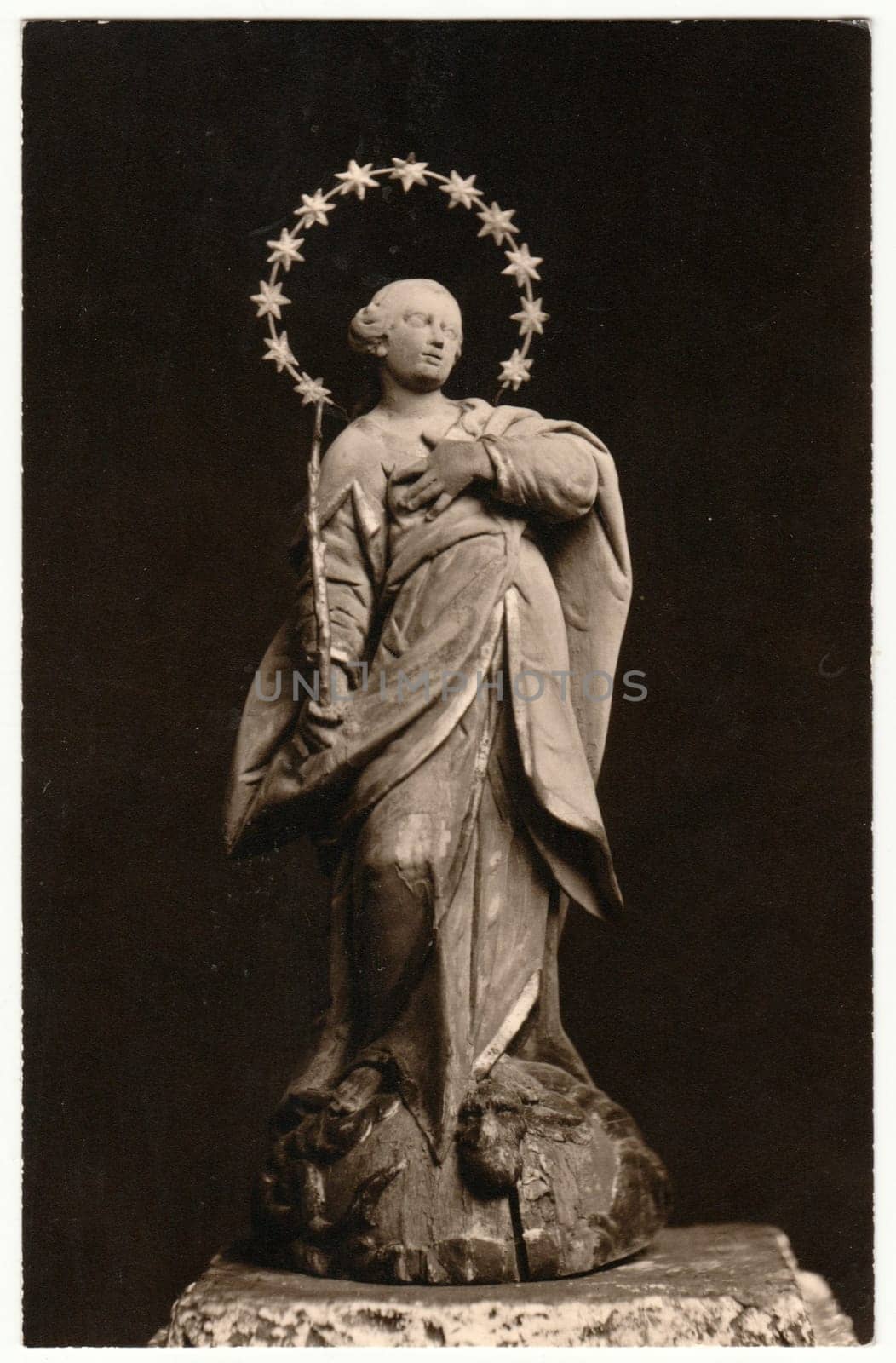 Vintage photo shows religious statue. Retro black and white photography. by roman_nerud