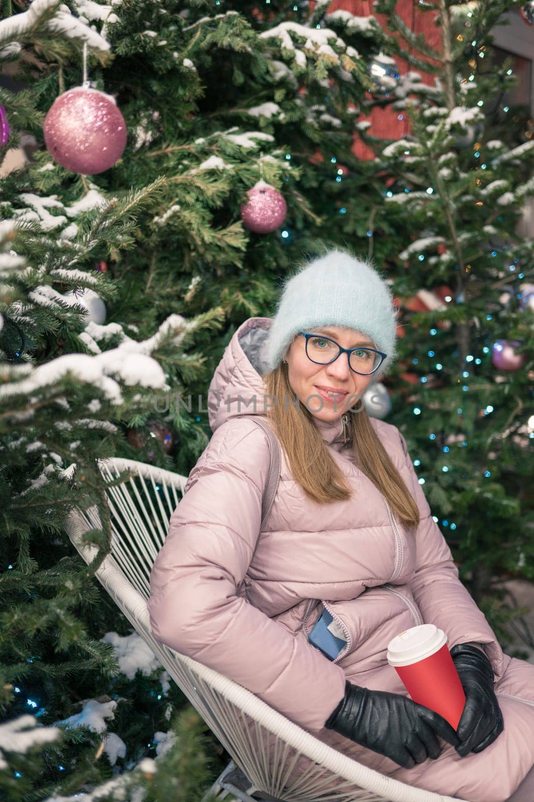 Pretty woman with fir tree. Xmas holidays, New Year or Christmas concept