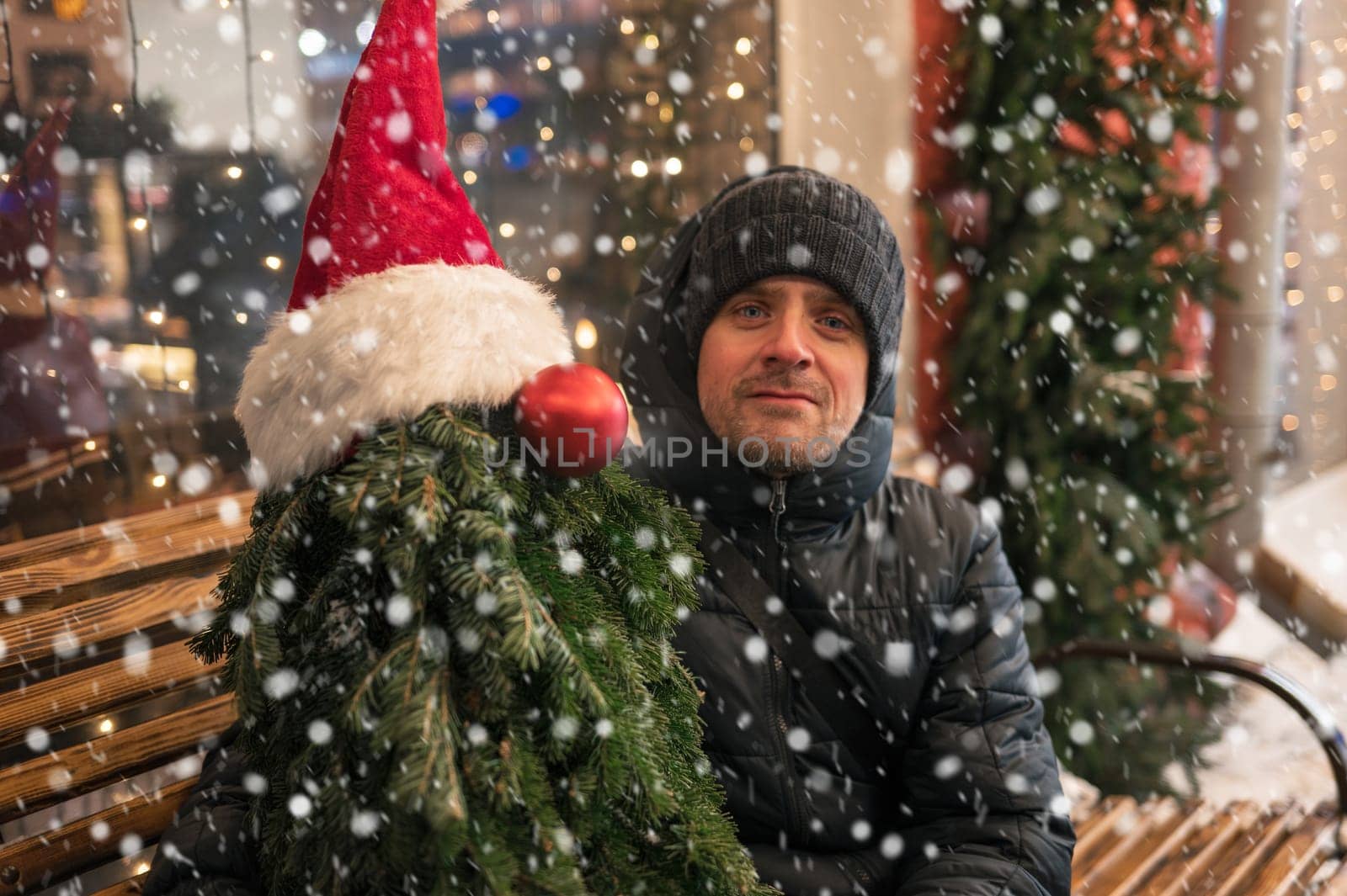 Man with fir tree decorated mannequin. Xmas holidays, New Year or Christmas concept