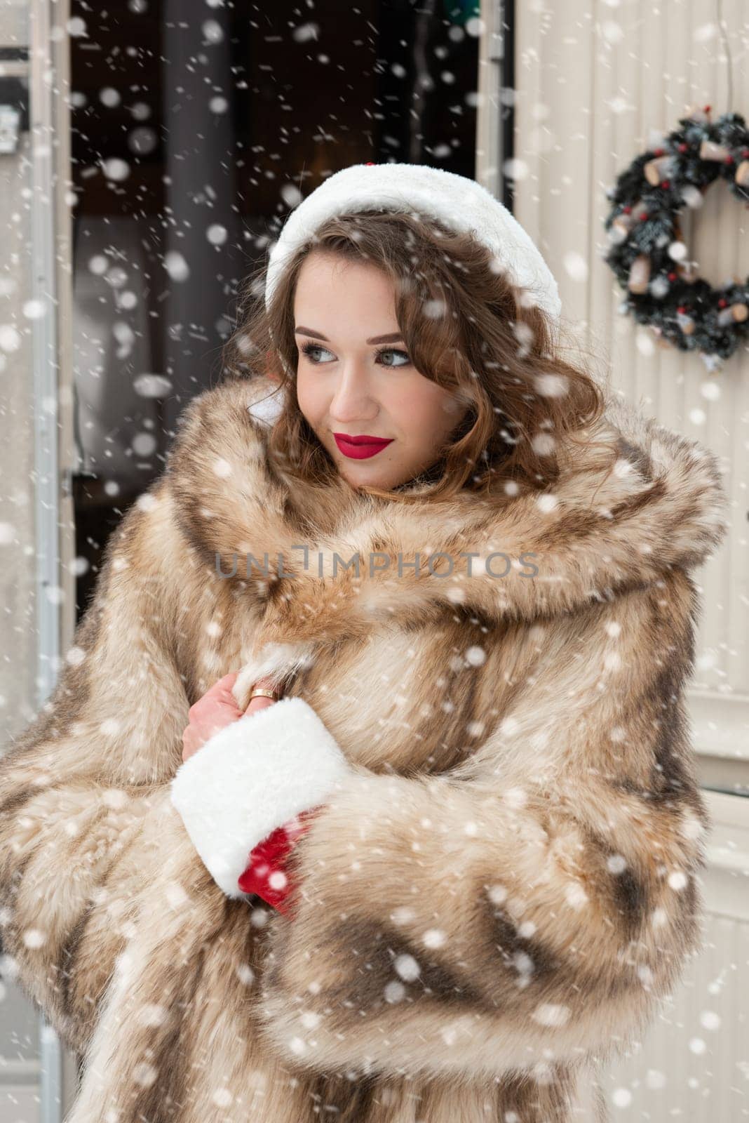 Young woman in fur coat at winter campsite by rusak