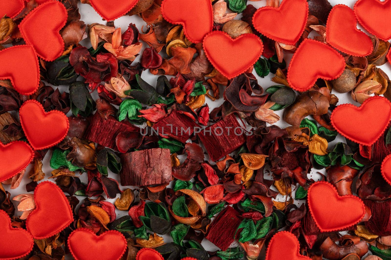 Different dry flowers with red hearts background. Valentines day or love concept