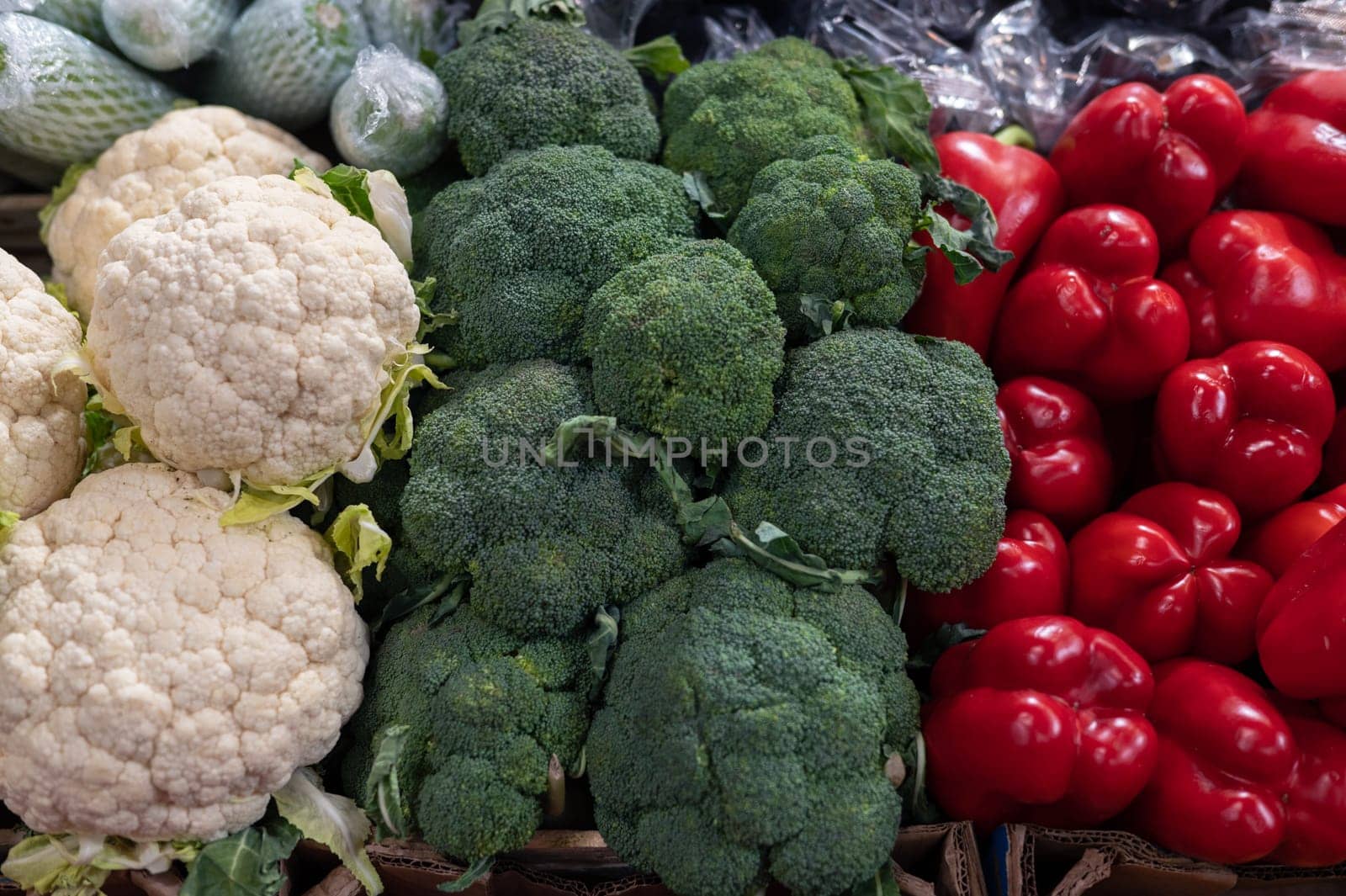 Vegetables at a market- Cauliflower, broccoli and red pepper as italian flag