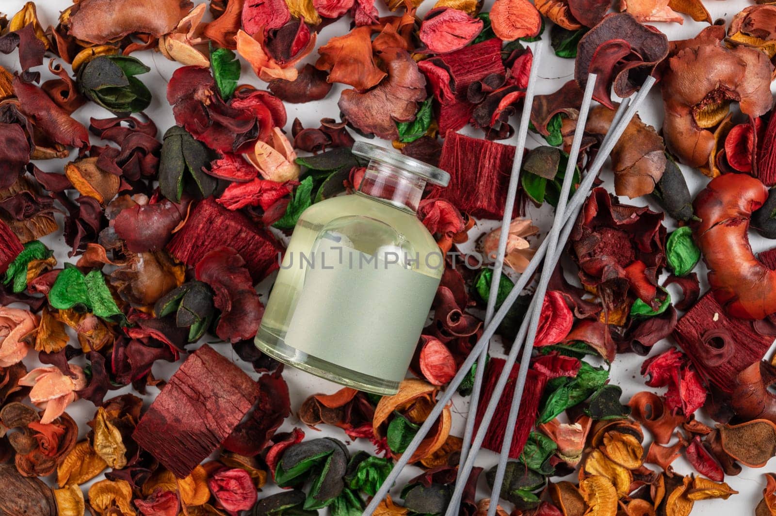 Home aroma fragrance diffuser on dry flowers background