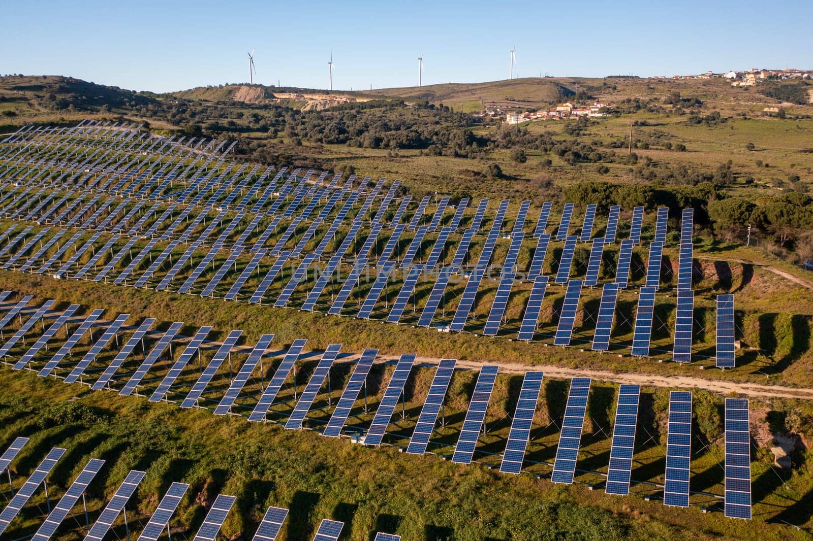 Photovoltaic panels at solar farm by andreonegin