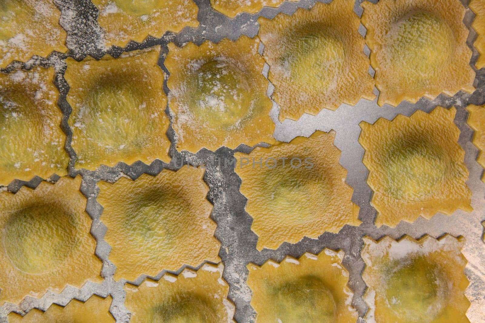 Recipe for Homemade Italian Ravioli pasta with Spinach and Ricotta Filling. High quality photo
