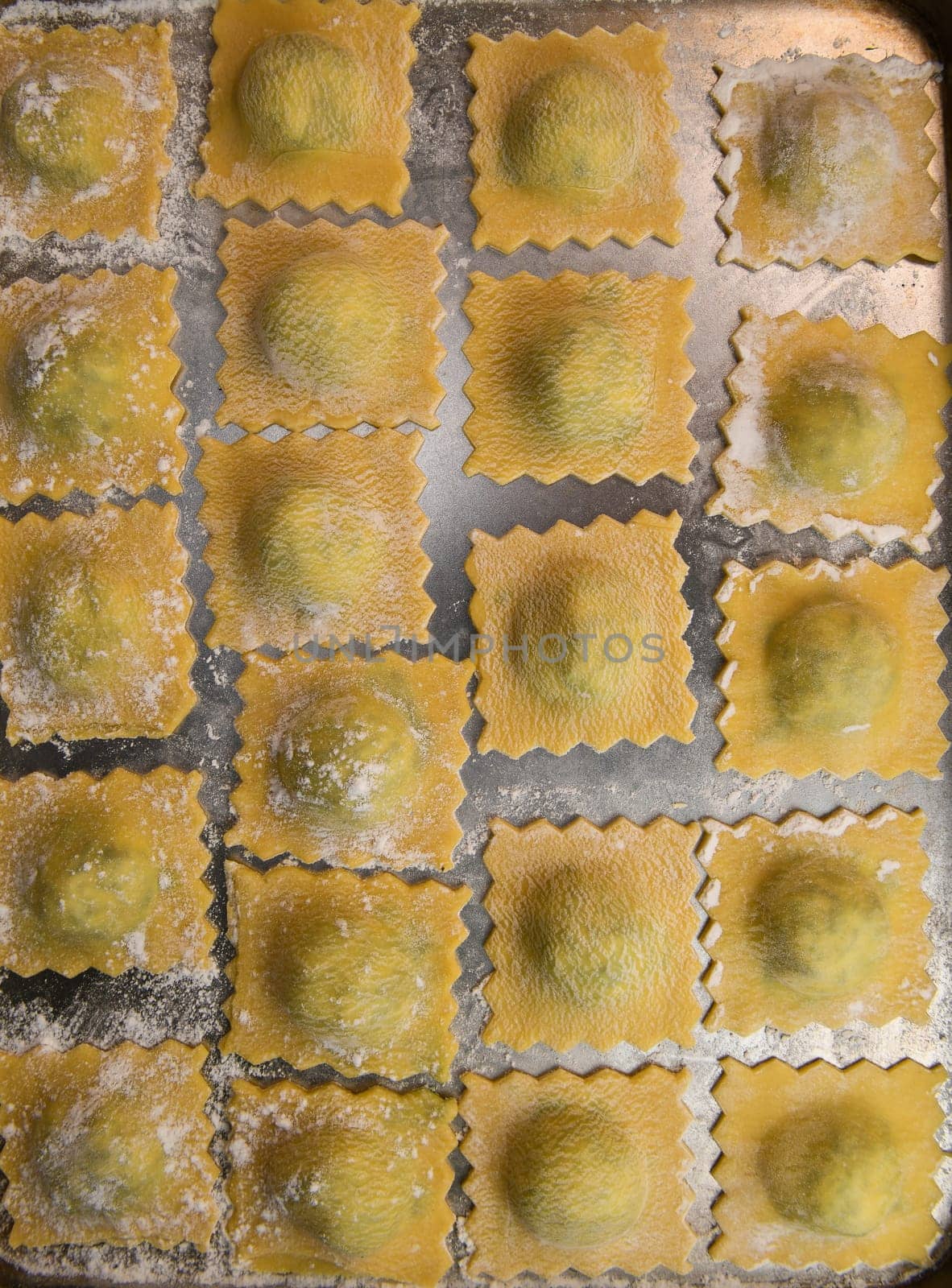 Recipe for Homemade Italian Ravioli pasta with Spinach and Ricotta Filling. High quality photo