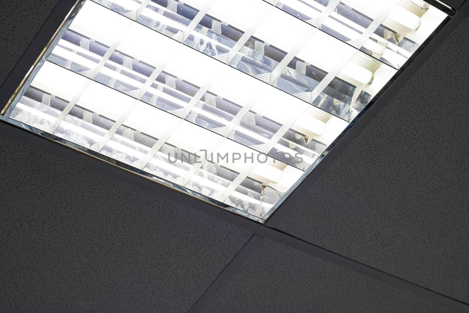 Modern white square form lamp in the ceiling close up