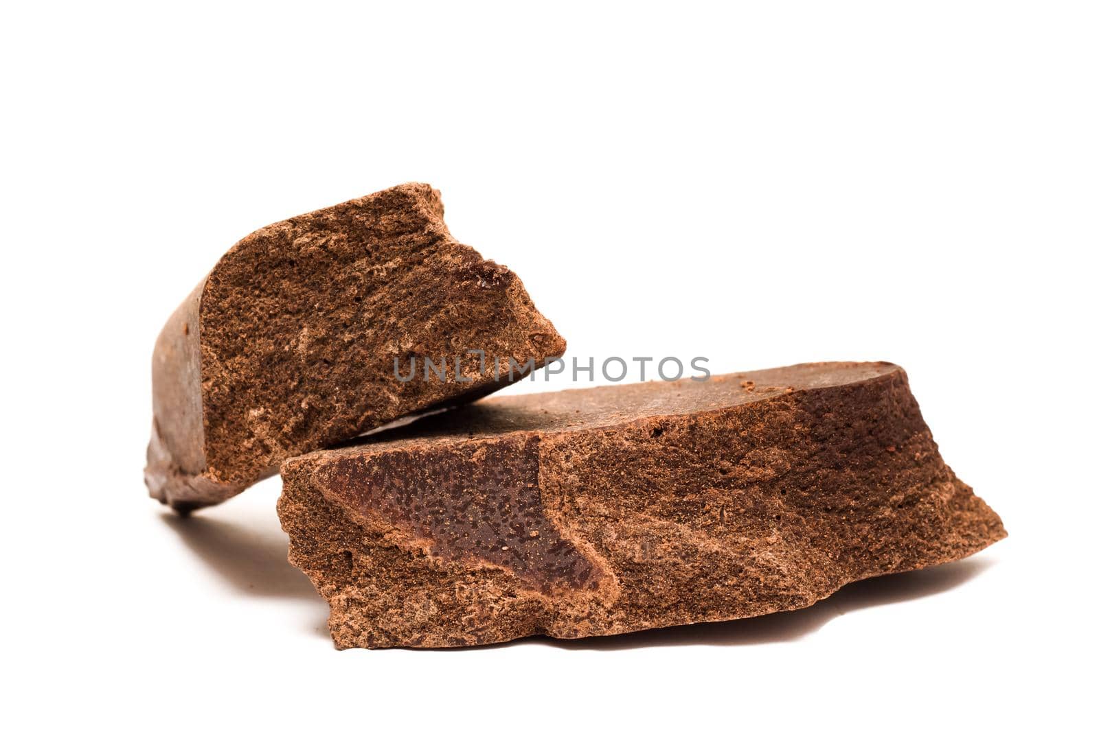 Large chunks of chocolate isolated on a ite background