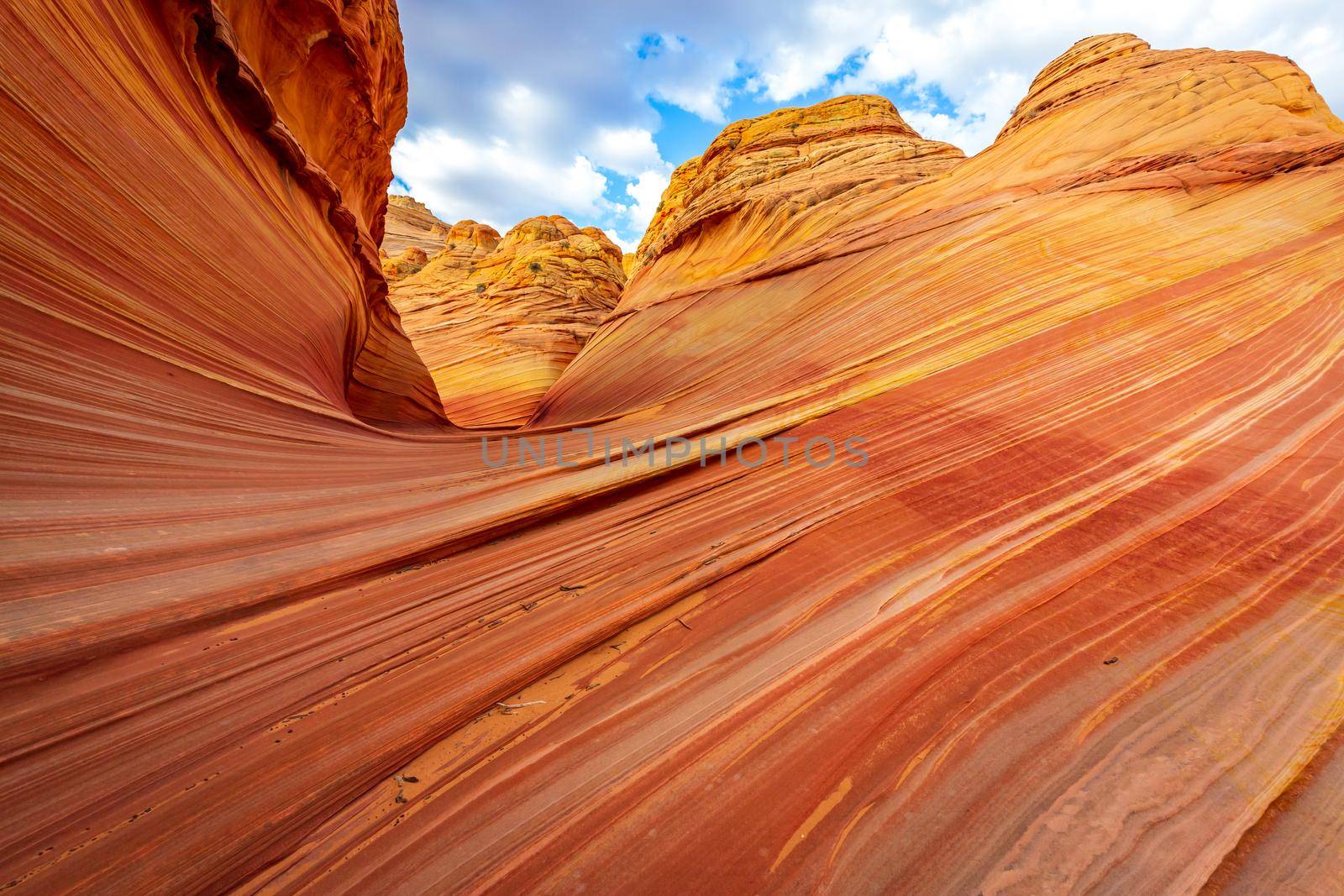 The Wave is a famous sandstone rock formation located in Coyote Buttes, Arizona, known for its colorful, undulating forms