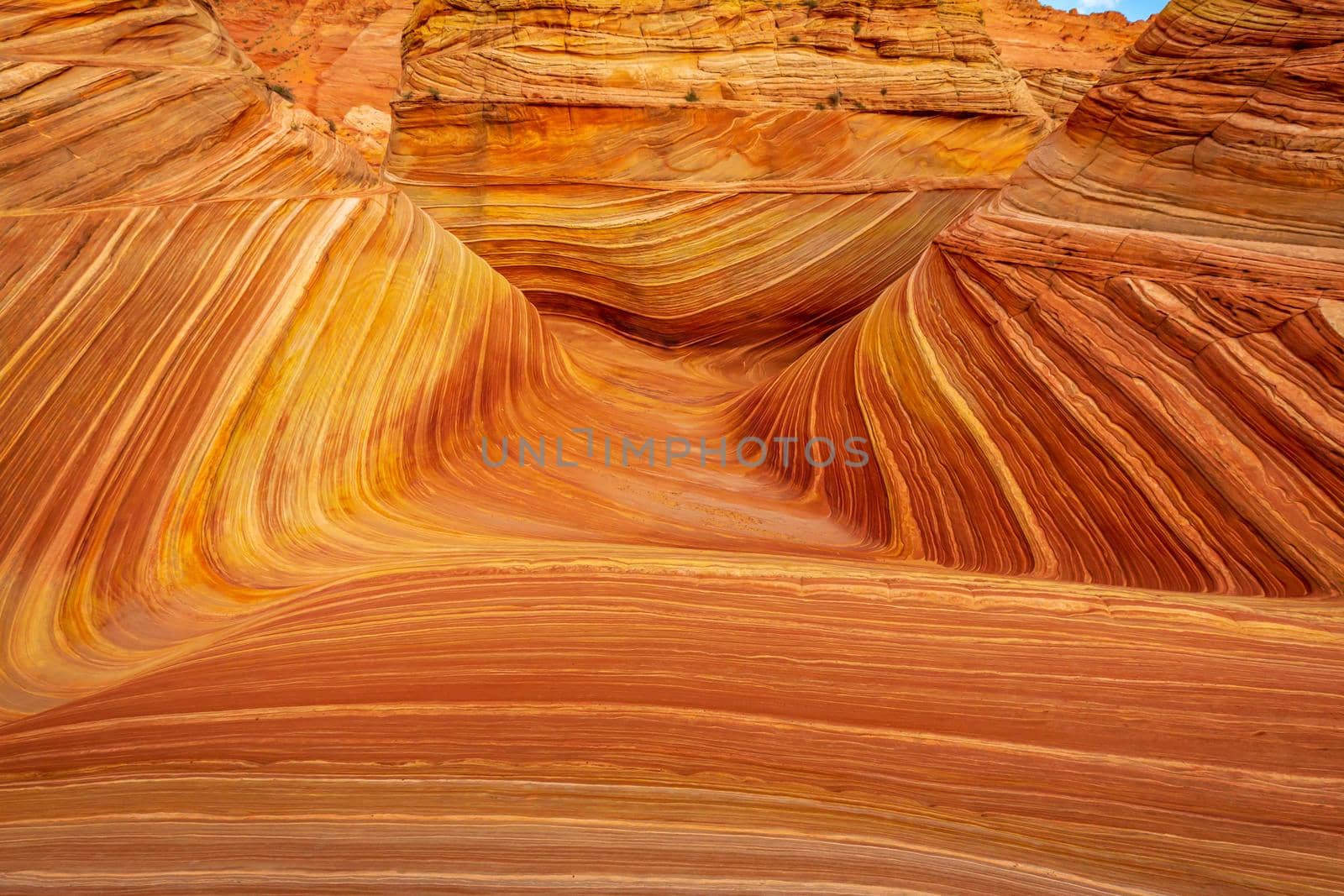 The Wave is a famous sandstone rock formation located in Coyote Buttes, Arizona, known for its colorful, undulating forms