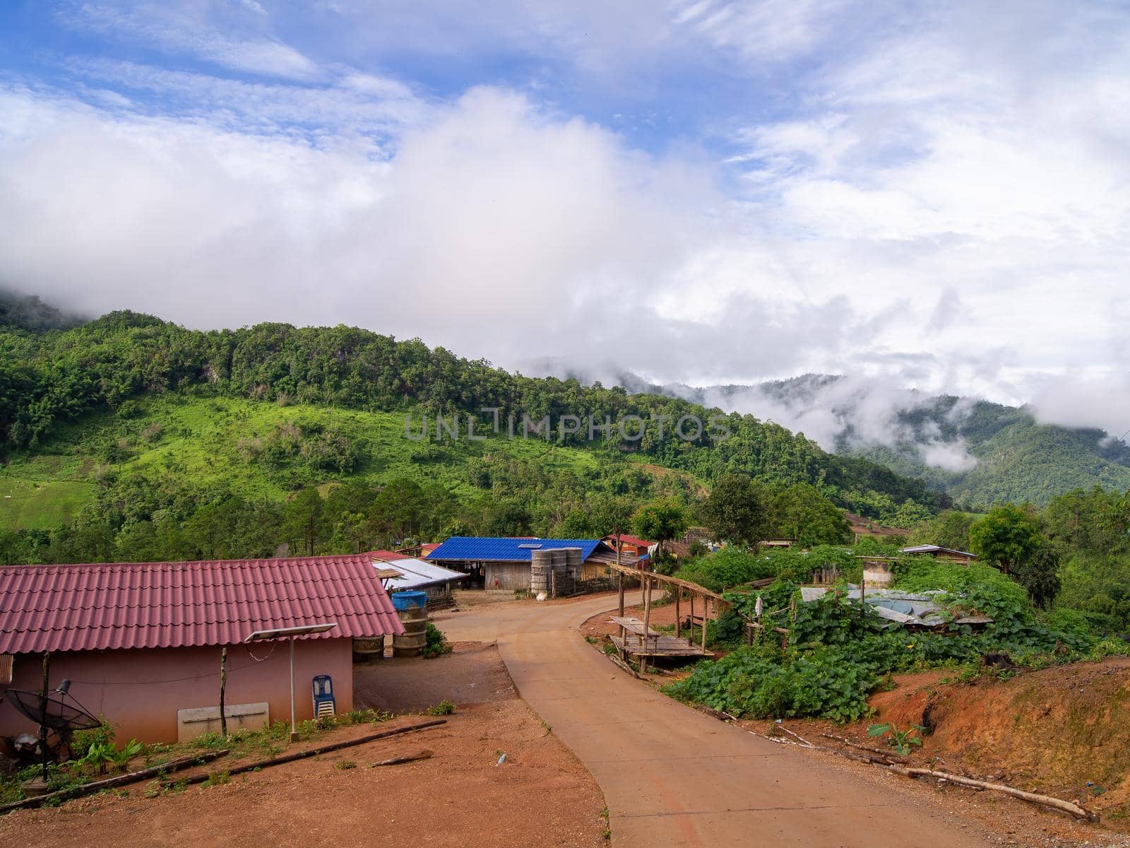Green mountain scenery, fog in the mountains, sky covered with white clouds.
Rural village in Panoramic, High view of the city in Chiang Mai, Thailand 