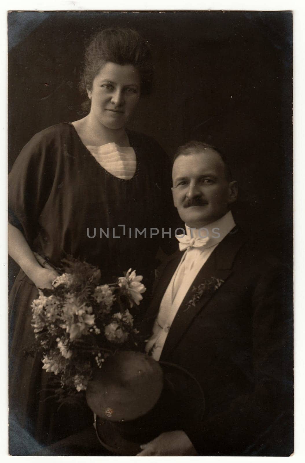 GERMANY- CIRCA 1923: Vintage photo shows an elderly couple. Retro black and white studio photography. Circa 1920s.