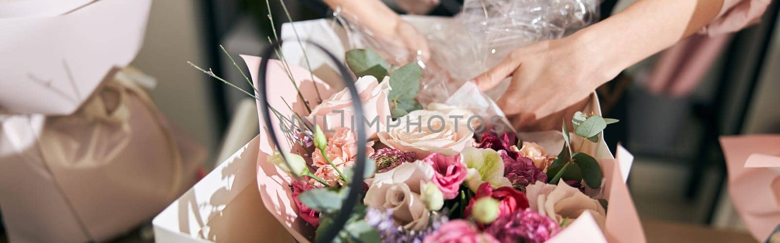 happy professional woman is working in flower shop