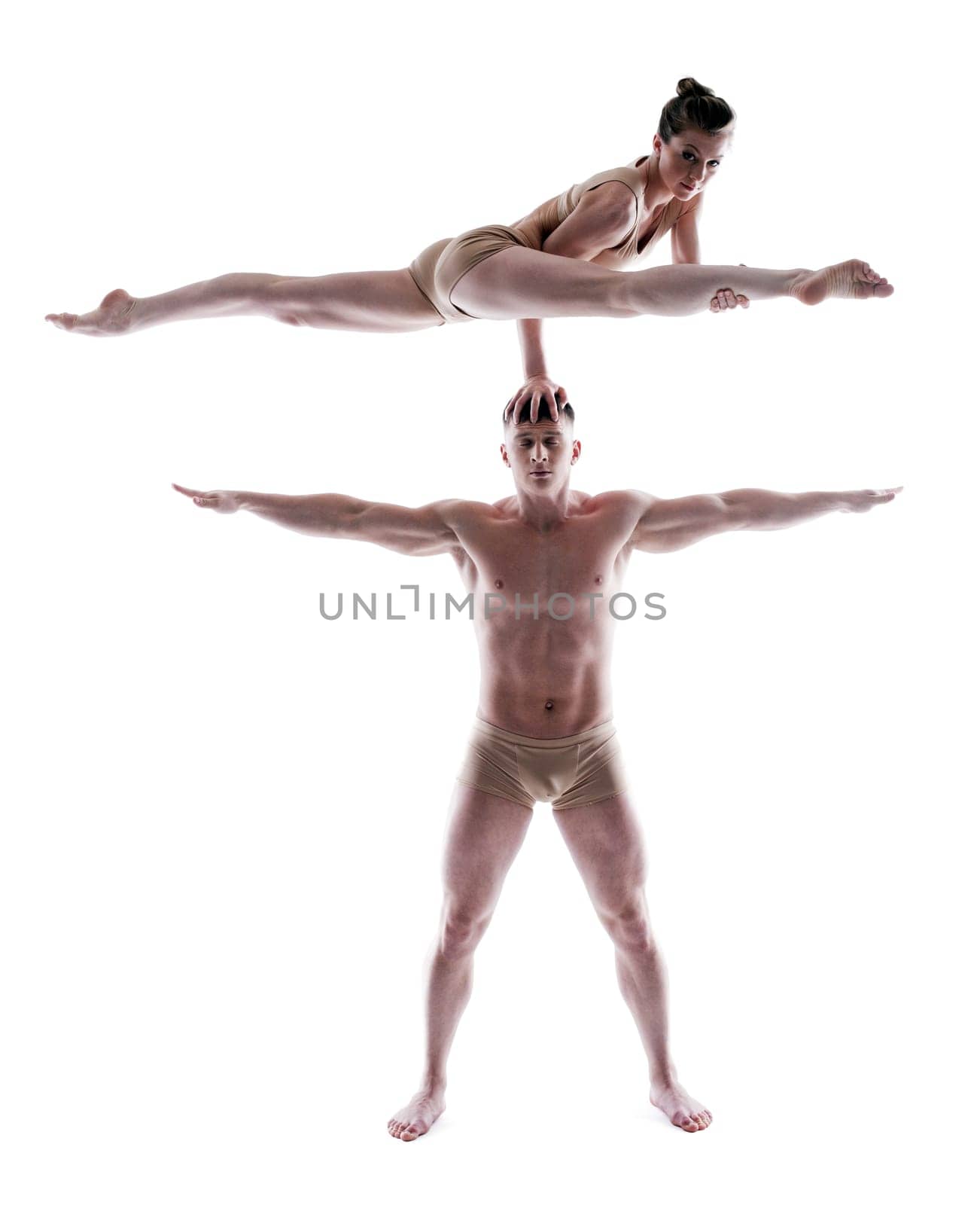Two flexible gymnasts posing in studio, isolated on white